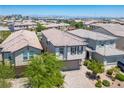 Desirable two-story home with attractive desert landscaping and a pristine exterior at 9136 Cocowoods Pl, Las Vegas, NV 89148