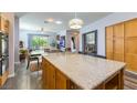 Bright, open kitchen flowing into the dining area with a large island and ample storage at 1004 Viale Placenza Pl, Henderson, NV 89011