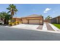 Charming single-story home with a three-car garage and desert landscaping at 1453 Doggett Ave, Las Vegas, NV 89123