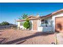 Charming single-story home with a well-maintained yard, gated entrance, and attached one-car garage at 1716 Luning Dr, Las Vegas, NV 89106