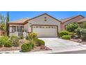 Inviting front yard showcasing xeriscaping and a well-maintained two-car garage at 2540 Binary Stars St, Henderson, NV 89044