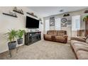 Relaxing living room featuring comfortable seating, modern decor, and ample natural light at 2856 Trossachs St, Henderson, NV 89044