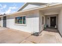 Welcoming front entrance featuring a decorative door and shaded porch area, enhancing curb appeal at 2990 Carnelian St, Las Vegas, NV 89121