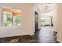 Grand entryway features unique tiled floors, arched doorways, and views to the beautifully landscaped outdoors at 3198 Stella Cilento Ave, Henderson, NV 89044