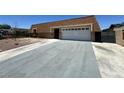 Modest home featuring a two-car garage and long driveway at 4200 Via Vaquero Ave, Las Vegas, NV 89102