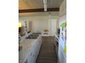 Efficient galley kitchen with stainless steel appliances and lots of counter space at 6409 Burgundy Way, Las Vegas, NV 89107