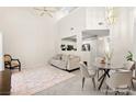 Bright living room featuring tile floors, high ceilings, and elegant furnishings at 68 Belle Soleil Ave, Las Vegas, NV 89123
