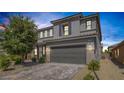 Inviting two-story home boasts a gray facade, tiled roof, and a spacious two-car garage at 7890 S Miller Ln, Las Vegas, NV 89113
