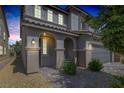 Lovely covered front porch with arched entryway and stone pillars, offering a welcoming entrance at 7890 S Miller Ln, Las Vegas, NV 89113