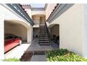 Charming townhouse featuring assigned covered parking, stairs, and mature landscaping at 8455 W Sahara Ave # 289, Las Vegas, NV 89117