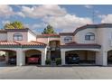 Inviting townhome showcasing assigned covered parking, common stairways, and neutral colors at 8455 W Sahara Ave # 289, Las Vegas, NV 89117
