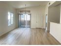Open living room featuring luxury vinyl floors and natural light at 8985 S Durango Dr # 2043, Las Vegas, NV 89113