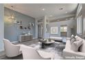 Inviting living room with elegant decor, comfortable seating, and an open layout enhancing the space's functionality at 950 Marbelwood Ave, Las Vegas, NV 89123