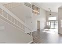Bright living room with high ceilings, hardwood flooring, and abundant natural light at 120 Wynntry Dr, Henderson, NV 89074