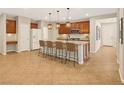 Spacious kitchen featuring a large island with seating, stainless steel appliances, and ample counter space at 121 Staplehurst Ave, Henderson, NV 89002