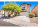 Attractive two-story home featuring a two-car garage and landscaping at 1844 Ghost Trace Ave, Las Vegas, NV 89183