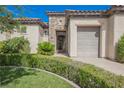 Charming single-story home with a well-manicured lawn and mature landscaping and a one-car garage at 2080 Powder Springs St, Henderson, NV 89052