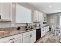 Kitchen area showcasing countertops and black appliances plus decorative accessories, and breakfast table at 2531 Dollison Ave, North Las Vegas, NV 89081
