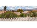 View of neighborhood tile roofs and the city skyline in the distance at 2624 Spalding Dr, Las Vegas, NV 89134