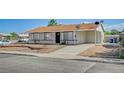Single story home features a long driveway and desert landscaping at 4047 Maple Hill Rd, Las Vegas, NV 89115