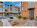 Contemporary home showcasing a private two-car garage and landscaped front yard at 4336 Guava Ct # 0, Las Vegas, NV 89135