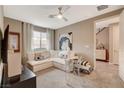 Cozy living room showcasing neutral tones, a ceiling fan, and an inviting sofa at 4336 Guava Ct # 0, Las Vegas, NV 89135