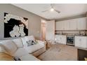Comfortable living room featuring a wet bar, mini-fridge, and modern decor at 4336 Guava Ct # 0, Las Vegas, NV 89135