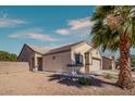 Lovely single-story home featuring a two-car garage and desert landscaping at 5028 Crying Heart St, North Las Vegas, NV 89031