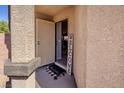 Inviting front porch with a 'Welcome' sign and stylish decor elements at 5028 Crying Heart St, North Las Vegas, NV 89031
