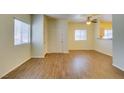 Bright living room featuring new floors, a large window, and a white entry door at 5250 S Rainbow Blvd # 2101, Las Vegas, NV 89118