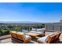 Inviting outdoor seating area with panoramic city views, ideal for relaxation at 527 Serenity Point Dr, Henderson, NV 89012