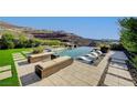 Relaxing pool area with comfortable seating, offering a serene outdoor experience at 527 Serenity Point Dr, Henderson, NV 89012