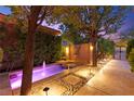 Beautifully landscaped courtyard features a serene water feature, creating a peaceful outdoor oasis at 5680 N Fort Apache Rd, Las Vegas, NV 89149