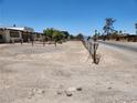 Spacious front yard with fence and home in background, plus adjacent street at 66 Lailani St, Las Vegas, NV 89110