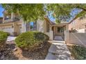 Charming single-Gathering home with manicured landscaping, paved walkway, and decorative exterior features at 7525 Royal Crystal St, Las Vegas, NV 89149