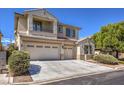 Well-maintained two-story home with three-car garage, concrete driveway, and mature landscaping at 7525 Royal Crystal St, Las Vegas, NV 89149