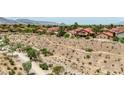 Scenic view of a desert community with hiking trails and well-maintained homes, offering a blend of nature and neighborhood charm at 8229 Sedona Sunrise Dr, Las Vegas, NV 89128