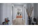 Hallway with elegant lighting and an open view to the living spaces at 8713 Long Winter Ct, Las Vegas, NV 89131