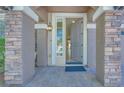 Inviting front entrance with stone pillars and an open doorway creates a welcoming first impression at 9628 Matanzas Creek Ct, Las Vegas, NV 89139
