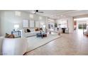 Spacious living area features tile floors, neutral tones, and plenty of natural light with an open floorplan at 9628 Matanzas Creek Ct, Las Vegas, NV 89139