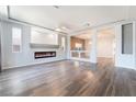 Stylish living room with hardwood floors, recessed lighting, and modern fireplace at 9883 Russian Hill St, Las Vegas, NV 89141