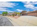 Wide exterior shot of a home featuring a xeriscaped front yard, desert landscaping, and a car port at 114 Tamarack Dr, Henderson, NV 89002