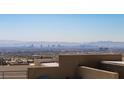Rooftop view of the Las Vegas skyline on a clear day, with distant mountains at 11695 Gentle Birdsong Ave, Las Vegas, NV 89138