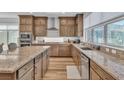 Spacious kitchen with granite countertops, stainless steel appliances, and custom cabinetry at 11695 Gentle Birdsong Ave, Las Vegas, NV 89138