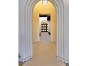 Close-up of the arched front entryway showcasing detailed millwork with a view of the wooden front door at 11906 Port Labelle Dr, Las Vegas, NV 89141