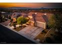 Beautiful aerial view of a home in a well planned community with a large drive and mountain views at 1744 Williamsport St, Henderson, NV 89052