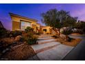Charming single-story home featuring a landscaped front yard, stone accents and a welcoming entrance at 1744 Williamsport St, Henderson, NV 89052