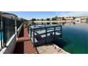 Charming dock overlooking the tranquil lake, perfect for peaceful waterfront enjoyment and relaxation at 2469 Sun Reef Rd, Las Vegas, NV 89128