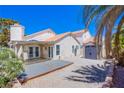 The backyard features a covered patio, gravel landscaping, and a shed for additional storage at 2752 Devita Cir, Las Vegas, NV 89117