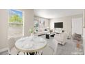 Cozy dining area flows into a bright living room, creating an inviting space at 6800 E Lake Mead Blvd # 1018, Las Vegas, NV 89156